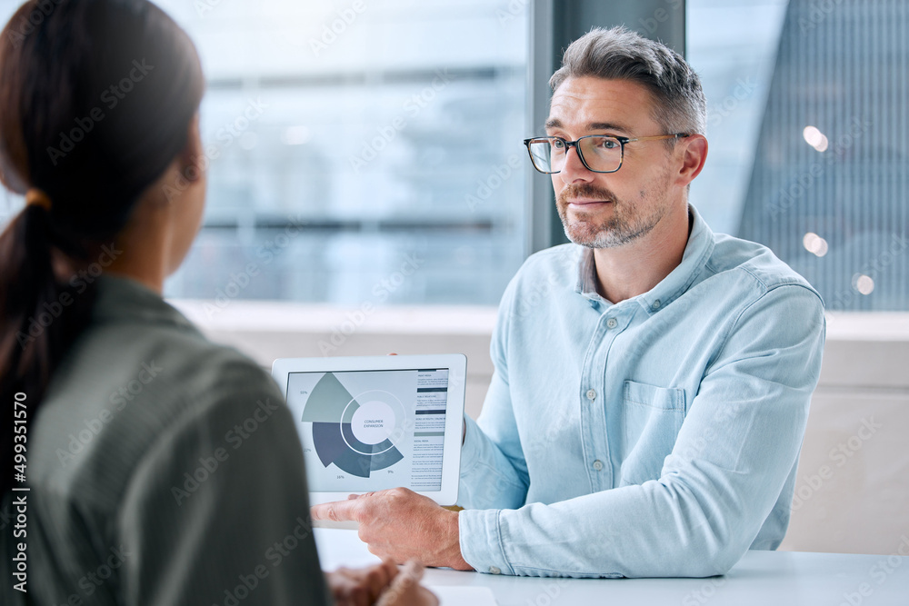 Aufkleber looking at patterns between data points. shot of a mature businessman speaking to a colleague while 