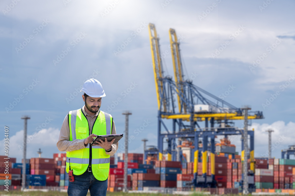 Aufkleber engineer wearing uniform inspection and see detail on tablet with logistics container dock cargo yar