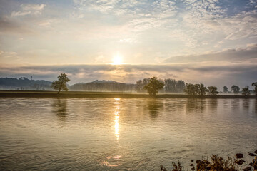 Fototapeta premium Stunning sunrise scene at the river danube in early spring between the small towns Osterhofen and Winzer in lower bavaria, germany