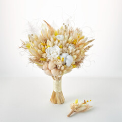 Beautiful yellow bouquet of dried flowers for the bride and groom