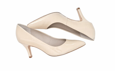 Female high heel classic shoes on white background. isolated image of beige elegant shoes. fashion blog concept