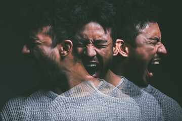 I didnt believe in monsters until my mind created them. Studio shot of a young man experiencing mental anguish and screaming against a black background.