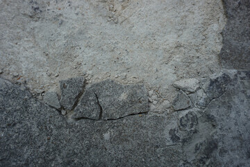 The shadow of the old gray cement wall surface with cracks