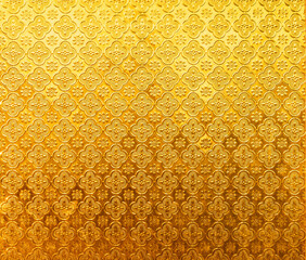 Metallic golden yellow mirror pattern texture background,Yellow glass vintage for wallpaper backdrop design.
