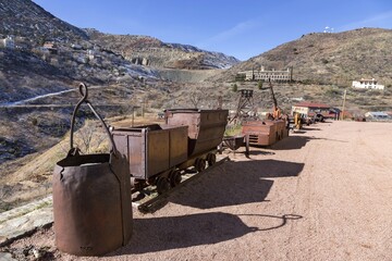 Vintage Old Rusted Mining Cart Equipment and Jerome Arizona Skyline