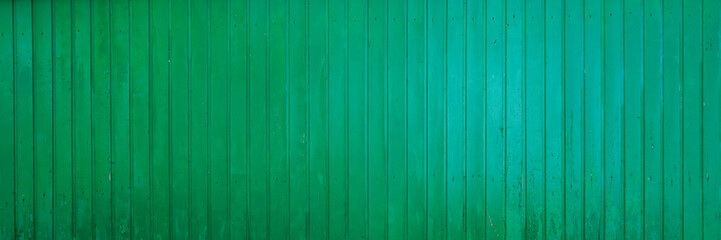 vertical planks shutter green wooden background texture in wood wallpaper in panoramic web format and header