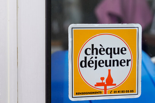 cheque dejeuner logo brand and text sign on door entrance windows restaurant