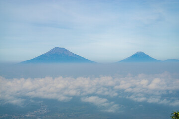 Landscape photo of mountain taken from highland with tree and bushes foreground . this is the view from top of Mount Telomoyo