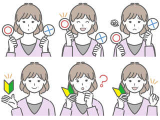 〇✕マークや初心者マークを持つ中年女性