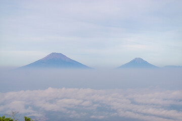 Landscape photo of mountain taken from highland with tree and bushes foreground . this is the view from top of Mount Telomoyo