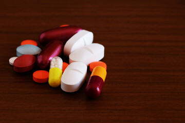 Set of drugs and pills on wood background, high magnification