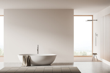 Obraz na płótnie Canvas Light bathroom interior with bathtub and douche. Mockup empty wall