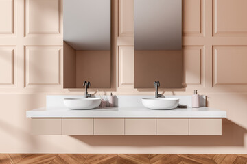 Light bathroom interior with sink and mirror, accessories on deck