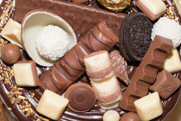 Delicious birthday chocolate cake on light table, close up	
