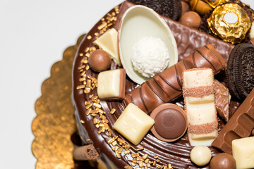 Delicious birthday chocolate cake on light table, close up	