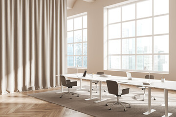 Fototapeta na wymiar Business interior with seat and table, laptop and window with city view