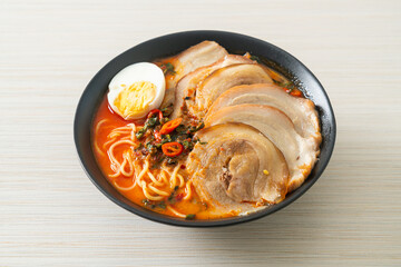 Ramen Noodles Spicy Tomyum Soup with Roast Pork