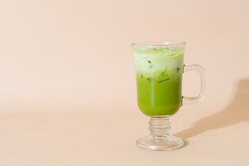 iced matcha green tea latte in glass
