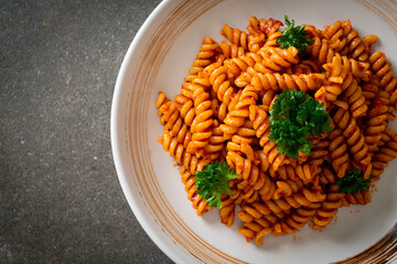 spirali or spiral pasta with tomato sauce