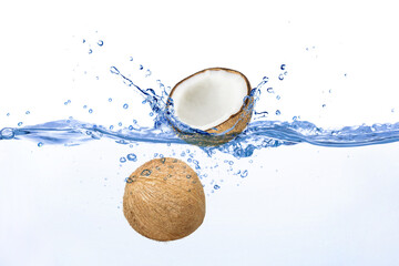 Coconuts with water splash on white