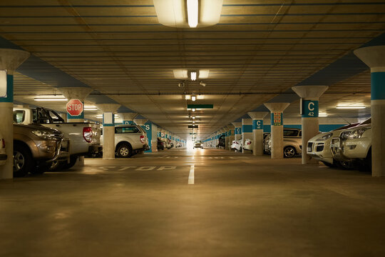 Park Wherever You Like. Shot Of An Underground Parking Garage Full Of Cars.