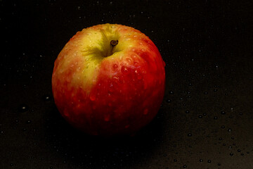 Apple pink lady isolated in black background - using studio lights