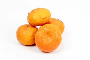 orange isolated in black background - shot in studio lighting.