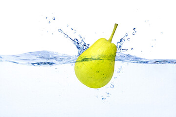 Green Pear fruit falling in water with splashing isolated on white background. © NIKCOA
