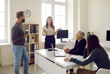 Businesswoman training speaker give presentation company meeting. Business woman in boardroom. CEO boss female speaker manager presenting a lecture in boardroom office workplace colleagues.