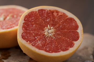 Ripe grapefruit on wood board closeup