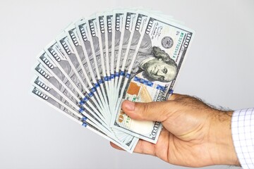 business man holding dollar in his hand