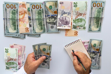 person counting money making calculations