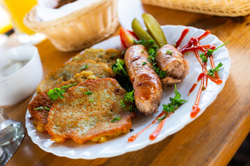 belarusian pancakes with sausages in a restaurant