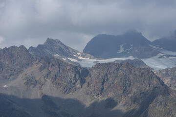 The peaks and glaciers of the Bernina group: one of the mountains of the Alps that exceeds 4000 meters, near the village of Chiesa in Valmalenco, Lombardy, Italy - September 2021.