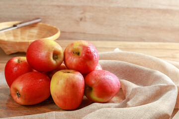 Closeup group of fresh Jazz Apples on wooden board background, Fruits concept.