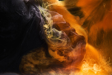 Orange smoke on black ink background, colorful fog, abstract swirling ocean sea, acrylic paint pigment underwater © amixstudio