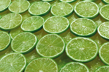 Fresh lime slices as a background.