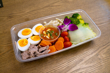 Salad in plastic box package delivery ready to eat