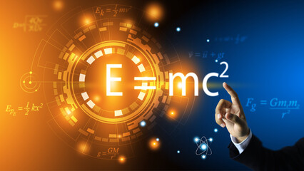 The teacher's hand points to the equation of relativity of Albert Einstein. E equals m multiplied...