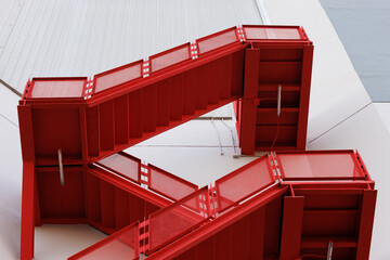 red fire exit stair, outdoor fire escape ladder. - obrazy, fototapety, plakaty