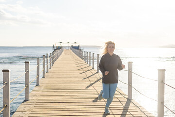 woman runs on a pontoon bridge in the Red Sea