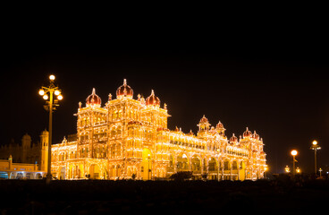 Fototapeta na wymiar Fully illuminated grand Mysore Palace during Dasara (Vijaya Dashami) Festivals, Mysuru, Karnataka, India