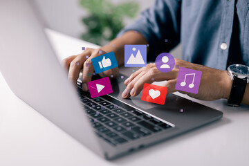 Content manager concept. Man works on laptop, publishes according to plan video, audio and images in social networks.