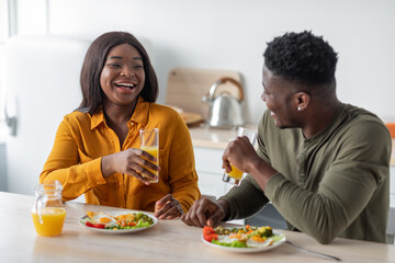 Portrait Of Young Black Couple Having Brekafast Together At Home