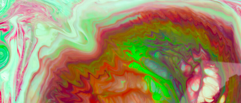 Psychedelic fluid art background. Multicolored stains on a liquid surface. Creative background with colored spots. Trendy abstract backdrop