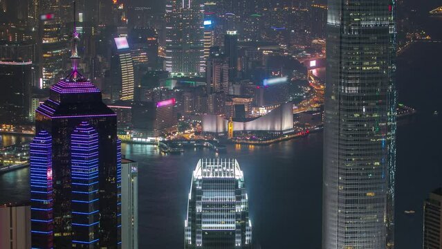 Hong Kong city skyline aerial timelapse at night with Victoria Harbor and skyscrapers