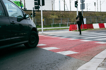 The car stopped in front of a pedestrian crossing