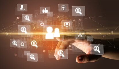 Hand pressing social media multimedia application screen with media icons on futuristic concept