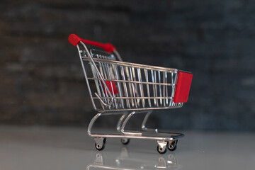 Shopping cart on digital background.