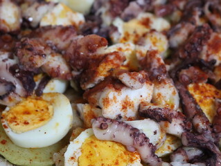delicious typical octopus dish with potato egg paprika tasty oil